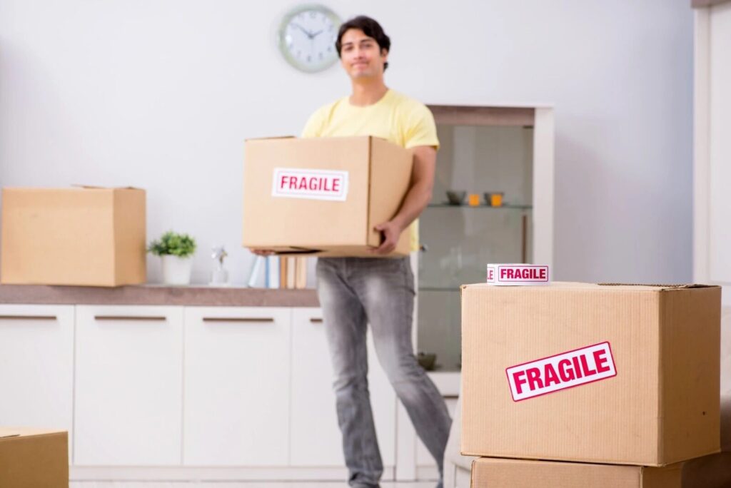 Movers DC Area personnel providing packing services for fragile items.